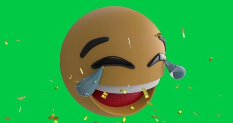 Confetti falling on laughing emoji with tear drops