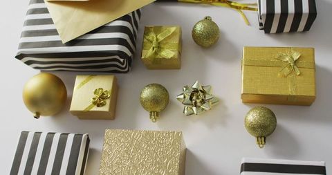 Elegant Gold and Black Gift Boxes and Decorations Flatlay