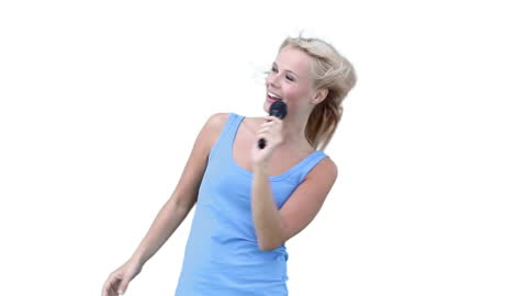 Woman Singing and Dancing with Microphone