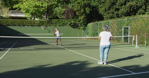 Senior Couple Enjoying Game of Tennis on Sunny Day - Download Free Stock Images Pikwizard.com