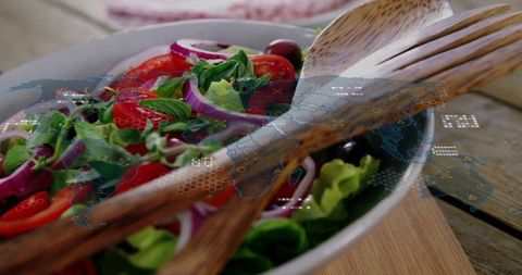 Vibrant mediterranean salad featuring wooden servers and holographic world map overlay