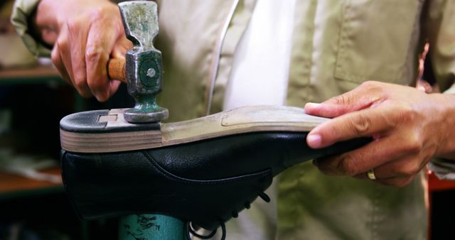 Cobbler hammering on shoe sole in workshop 4k