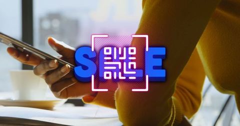 Using Smartphone with Neon QR Code Interface in Modern Setting