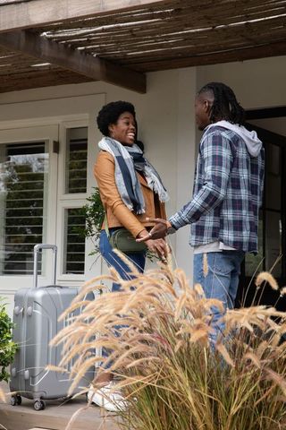 Couple Connecting on Porch Before Travel Adventure