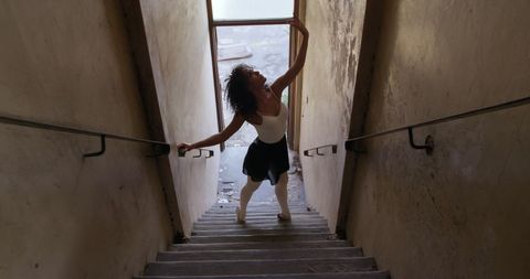 Ballet Dancer Gracefully Posing in Urban Stairwell - Download Free Stock Images Pikwizard.com