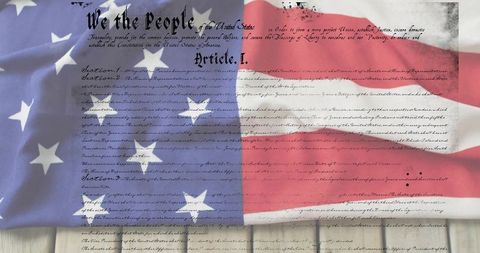 Draping american flag revealing constitution parchment over weathered wood for patriotic design