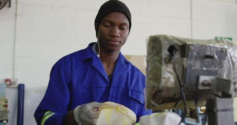 Factory worker molding cricket ball core material