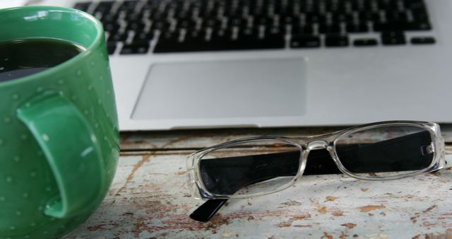 Close-up of Coffee, Eyeglasses, and Laptop on Rustic Wooden Table - Download Free Stock Images Pikwizard.com