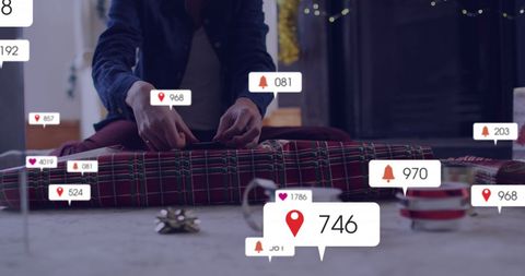 Person Packing Gifts with Social Media Notifications Concept