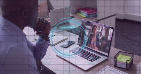 Businessman Engaging in Virtual Meeting with Digital Interface