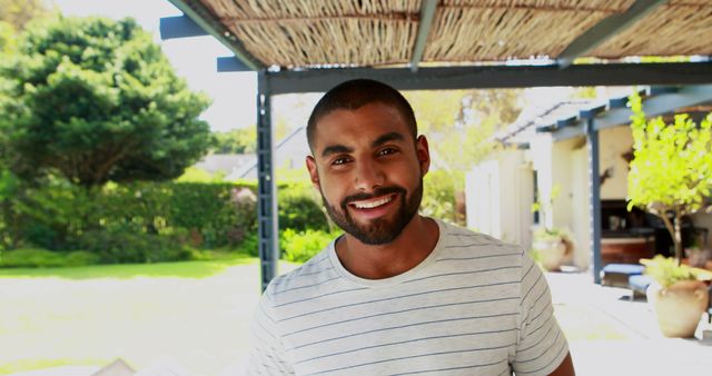 Smiling Man Enjoying Outdoors in Sunny Garden - Download Free Stock Images Pikwizard.com