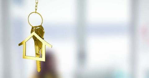 Luxury Golden House Keychain with Home Interior Background