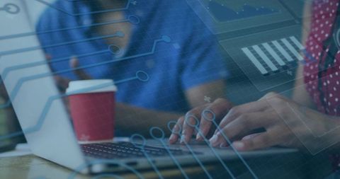 Healthcare team collaborating on laptop with data overlay and analytics, coffee cup