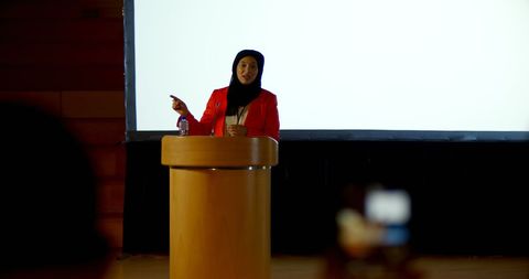 Confident Businesswoman in Hijab Delivering Speech