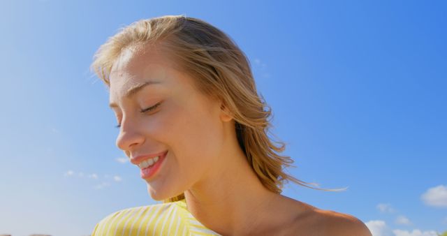 Young Woman Smiling in Bright Sunlight at Beach - Download Free Stock Images Pikwizard.com