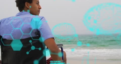 Man in Wheelchair Experiencing Beach with Futuristic Infographics