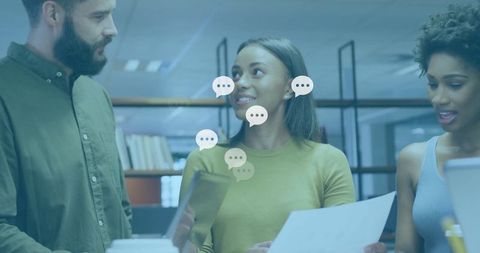 Team Collaborating in Modern Office Environment with Digital Devices