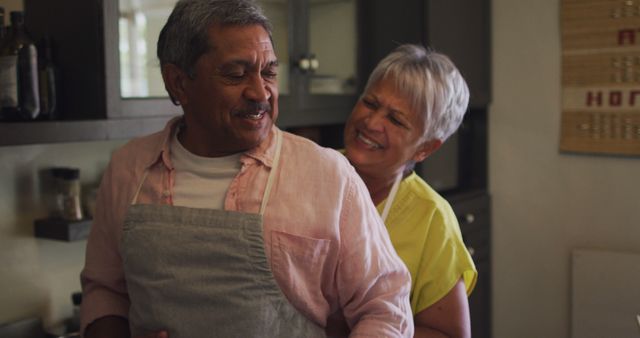 Senior Couple Enjoying a Happy Moment Together in Kitchen - Download Free Stock Images Pikwizard.com