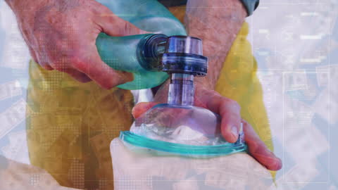 Hands Demonstrating Use of Respiratory Device with Data Overlay