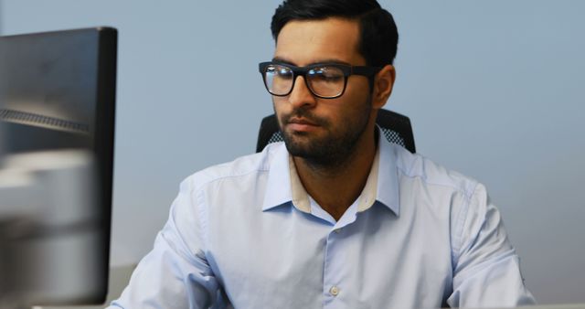 Focused Man Working at Computer in Office - Download Free Stock Images Pikwizard.com