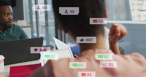 Diverse Team Analyzing Social Media Notifications and Strategy