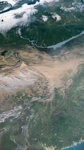 Vertical aerial descent over mountain rivers and glacial meltwater channels