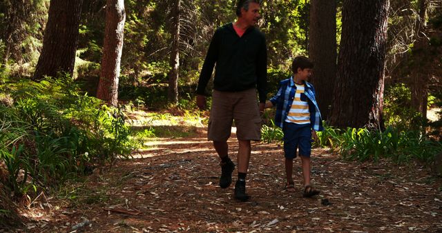 Father and Son Walking in Forest Trail for Outdoor Adventure - Download Free Stock Images Pikwizard.com