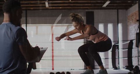 Dynamic fitness training with squat jumps in boxing gym