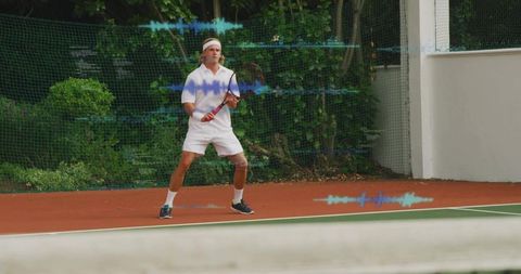 Tennis player training on red clay court with digital interfaces