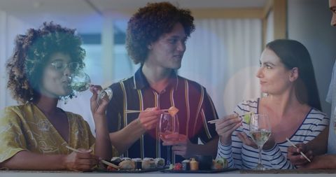 Diverse Friends Enjoying Sushi and Wine Gathering