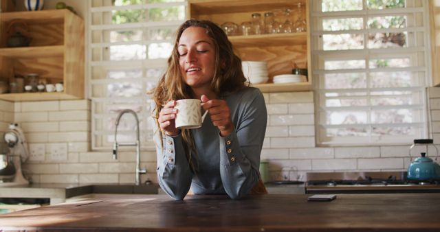 Young Woman Enjoying Morning Coffee in Bright Kitchen - Download Free Stock Images Pikwizard.com