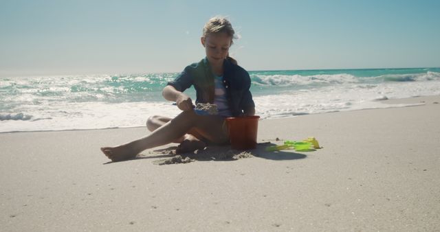 Young Child Playing with Sand Toys on Sunny Beach - Download Free Stock Images Pikwizard.com