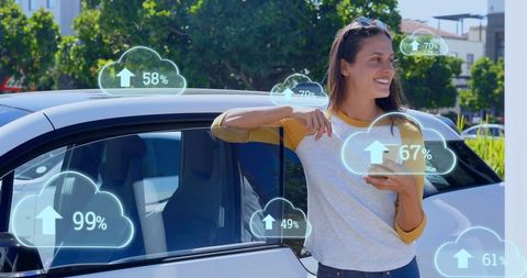 Woman interacting with cloud technology using smartphone outdoors