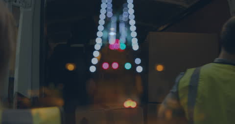 City Night Lights Overlay on Warehouse Workers Animation