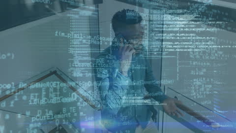 Businessman using technology with digital data overlay