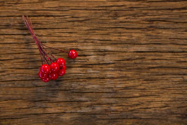 Bunch of fake cherry on wooden plank - Download Free Stock Photos Pikwizard.com
