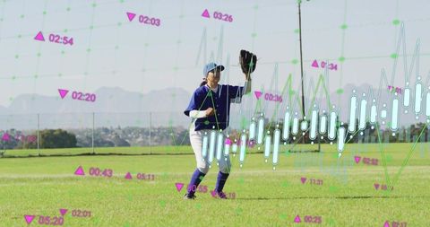 Female baseball outfielder fielding on grass with digital performance analytics overlay