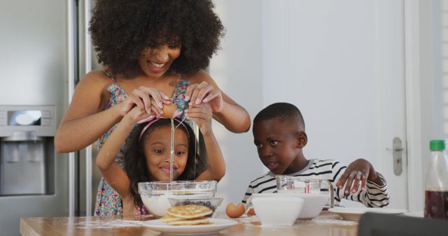 Mother and children are baking in a kitchen, cracking eggs into a mixing bowl. Smiling faces indicate joy and togetherness. Perfect for illustrating family activities, cooking enthusiasm, and quality family time. Can be used in advertisements for kitchen products, family-oriented services, and lifestyle blogs focusing on family and parenting.
