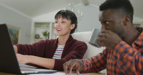 Collaborative Couple Working on Innovating Ideas at Home