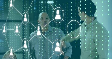 Team collaborating with digital network overlay and data visualization in office