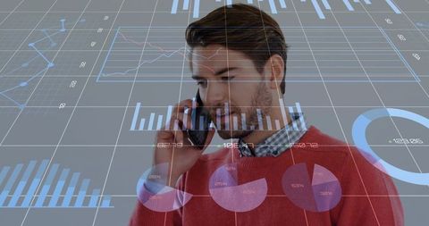 Business analyst calling on smartphone while analyzing digital dashboards and charts