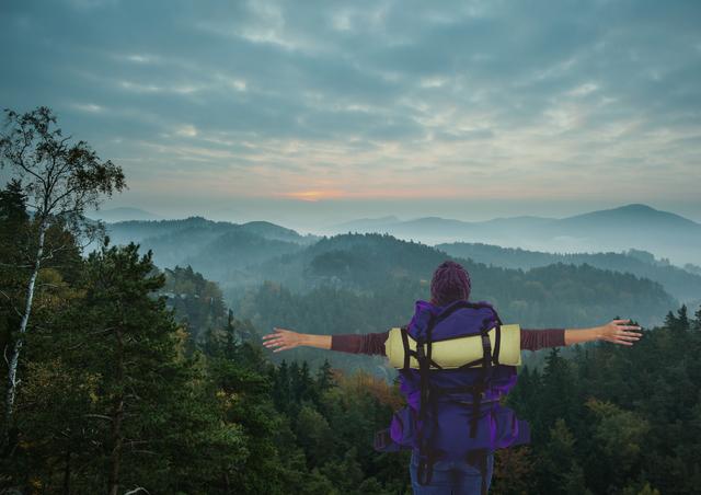 Digital composite of travel mountain. woman with purple hat and bag.