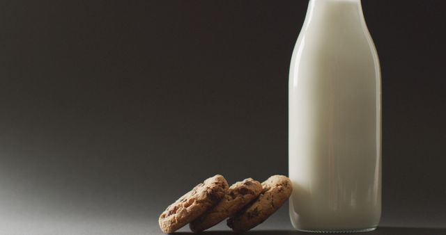 Image of biscuits with chocolate and milk on dark background - Download Free Stock Photos Pikwizard.com