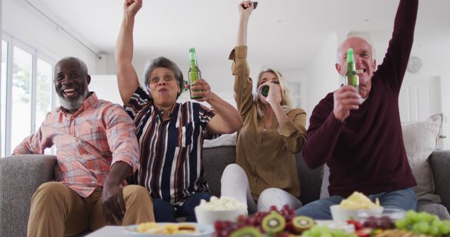 Group of Diverse Friends Cheering with Beers in Living Room - Download Free Stock Images Pikwizard.com