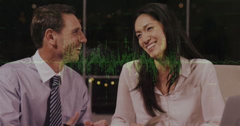 Business People Analyzing Data with Financial Overlay