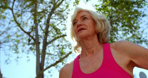Senior Woman Enjoying Outdoor Yoga in Nature