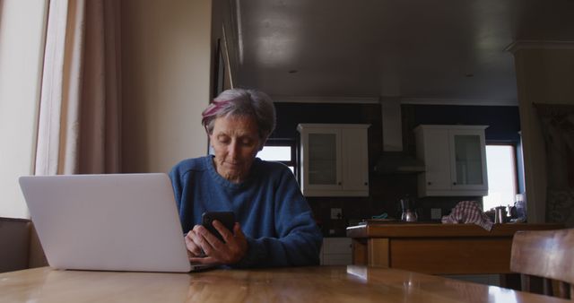 Senior Woman Using Laptop and Smartphone at Home - Download Free Stock Images Pikwizard.com