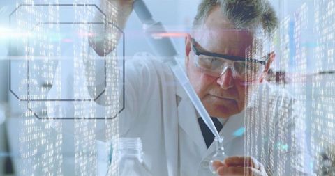 Senior scientist conducting laboratory experiment with pipette and data