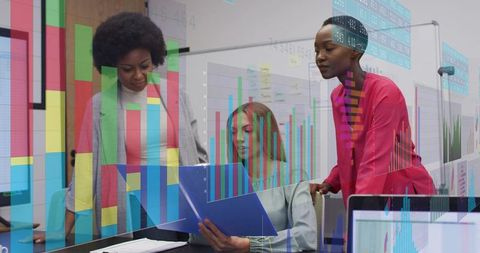 Reviewing data and analytics - diverse women team analyzing charts with laptop and folder