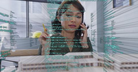 Businesswoman Analyzing Data with Futuristic Digital Interfaces